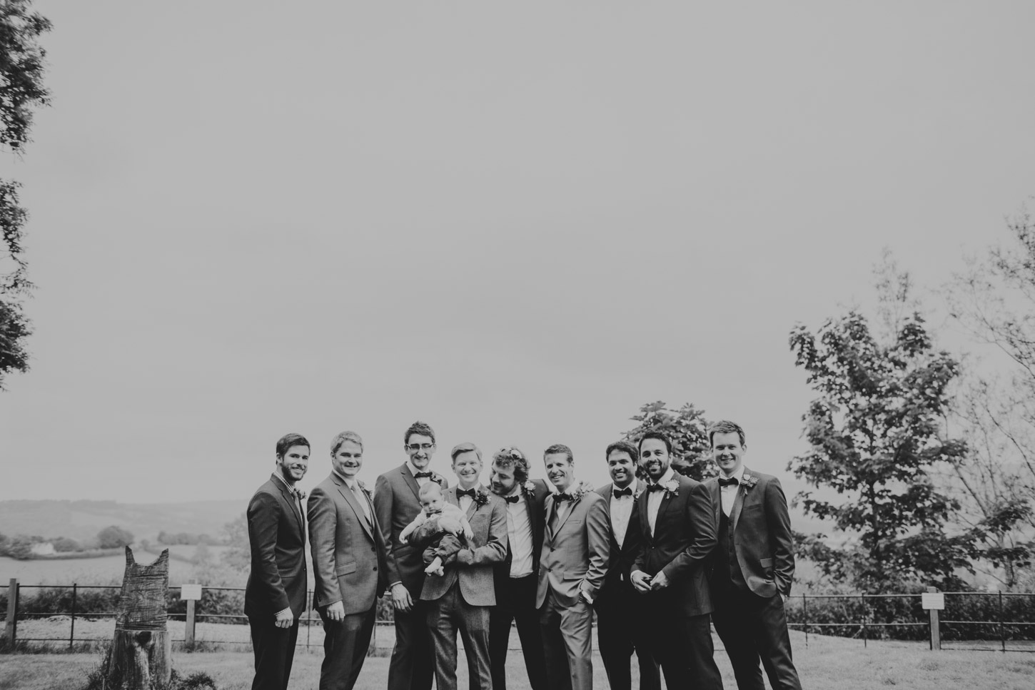 black and white groomsman photo in english setting