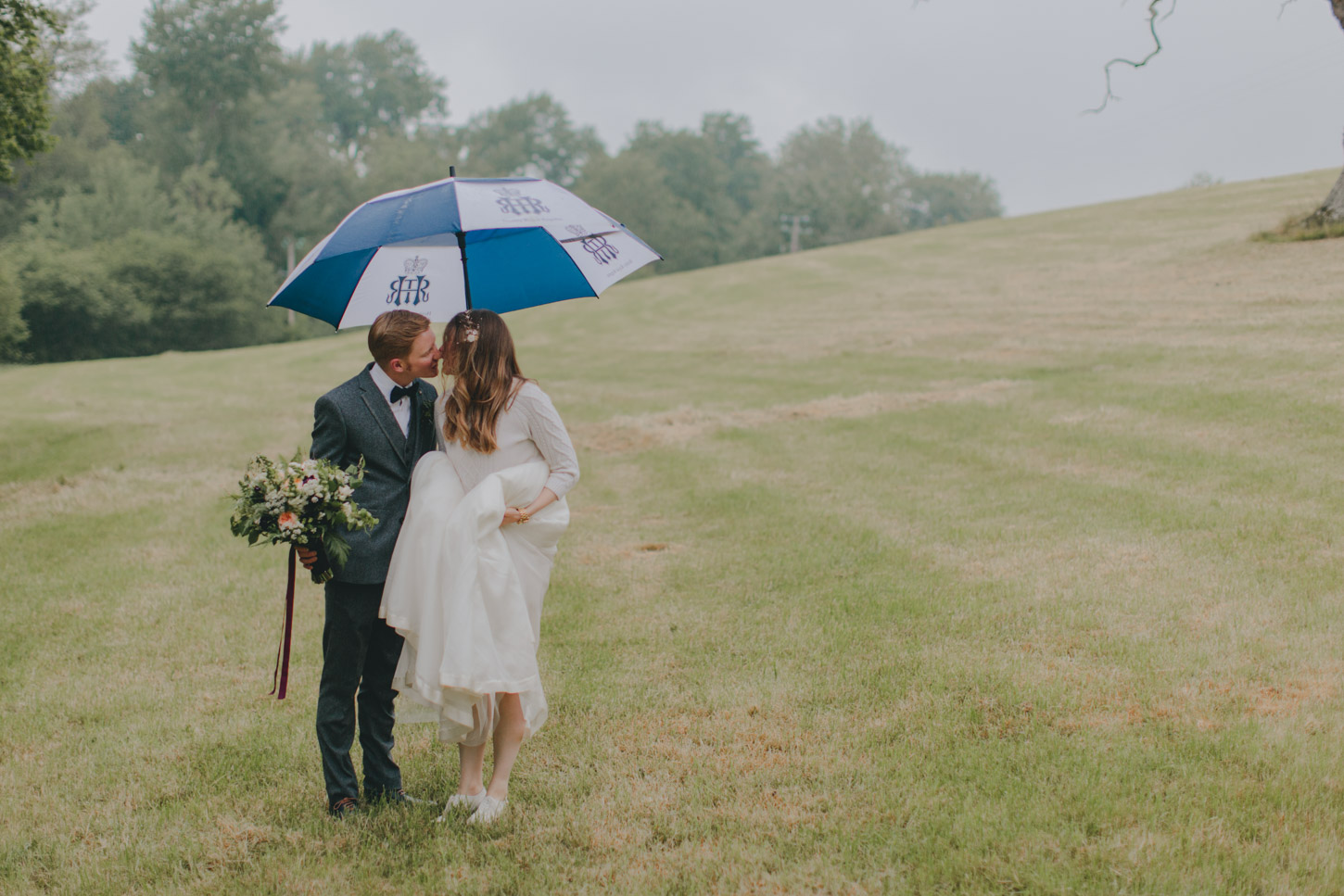 behind the scenes of bride and groom in poring rain