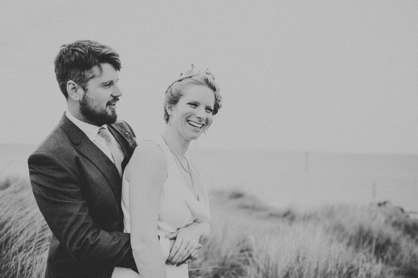 black and white image of Bride and Groom in Dunes by Tori Hancock Photography